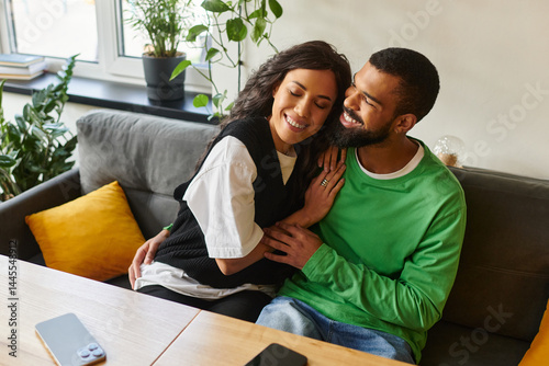 Obraz na plátně Joyful moments shared between a couple in a cozy cafe setting