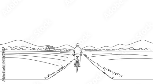 Person cycling through a peaceful landscape under a clear sky  