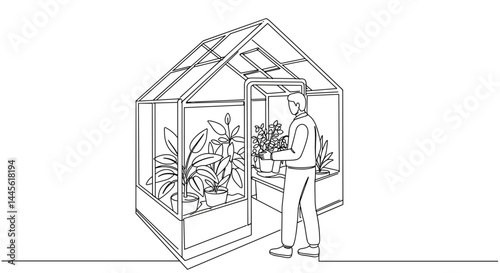 Person caring for indoor plants in a modern greenhouse  