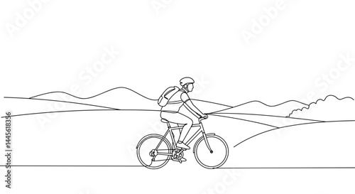 Cyclist riding a mountain bike against a scenic landscape  