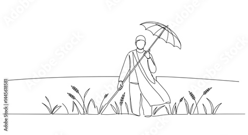 Farmer walking with umbrella in rice field  