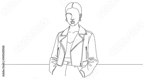 Stylish woman in a leather jacket posing confidently against a line  