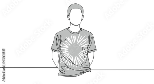 Young man wearing a graphic t-shirt posing against a plain background  