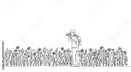 Person photographing flowers in a garden setting  