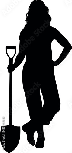 Silhouette of a female gardener carrying a large shovel
