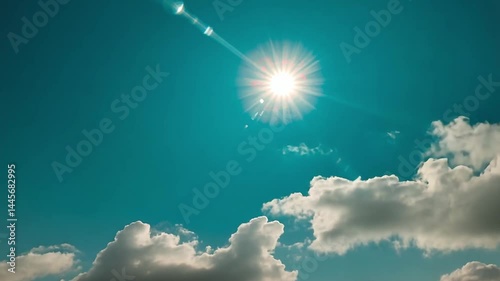 Bright Sunlight Shining Through Fluffy Clouds in a Clear Blue Sky