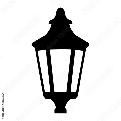 Classic Silhouette of a Vintage Street Lamp Post Illuminating the Night