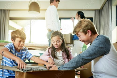 Real estate, unpacking and children with toys, home and siblings with boxes for move or excited. Living room, family and parents with investment of property, happy or kids with cardboard in new house