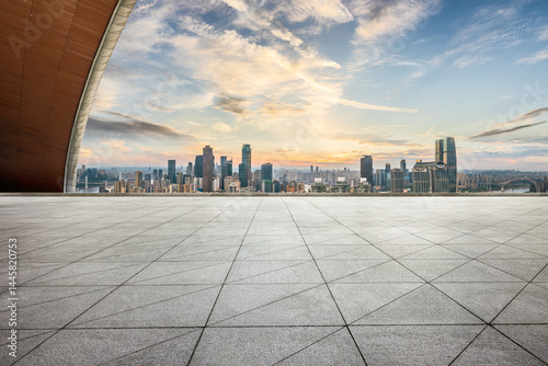 Empty stone floor and modern city building skyline during sunset in Chongqing. Urban landscape background.