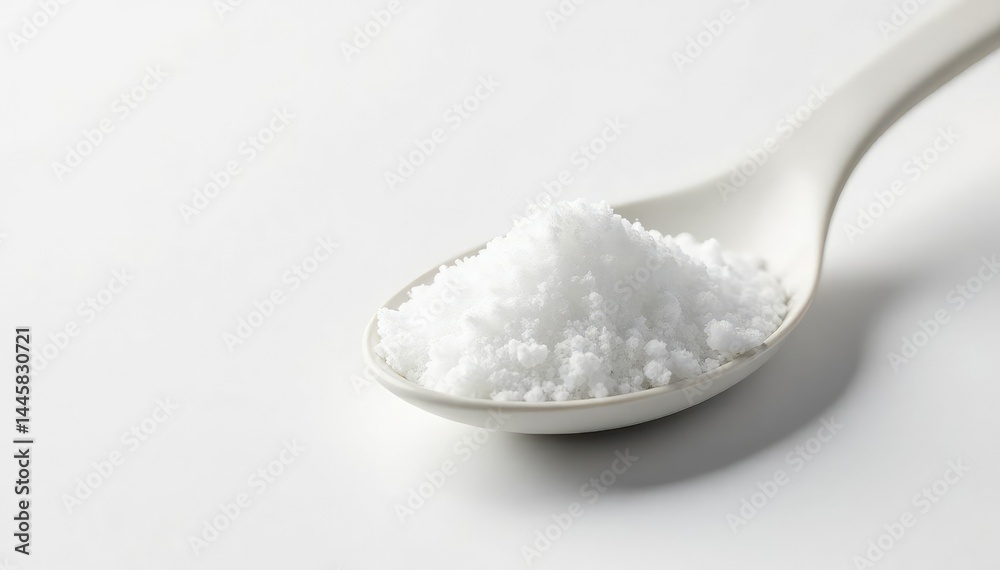 Spoonful of white sugar against white backdrop, delicious, photography Spoonful of white sugar against white backdrop, delicious, photography