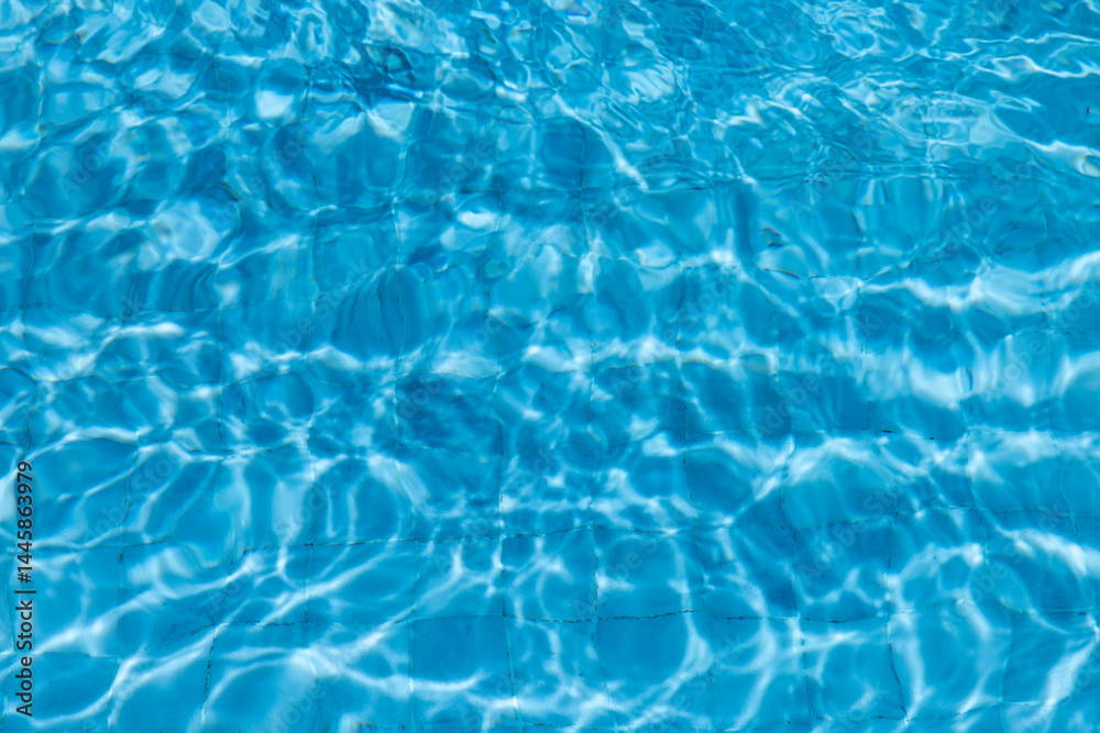 Obraz premium Blue Water Pool Surface with Sunlight Reflections