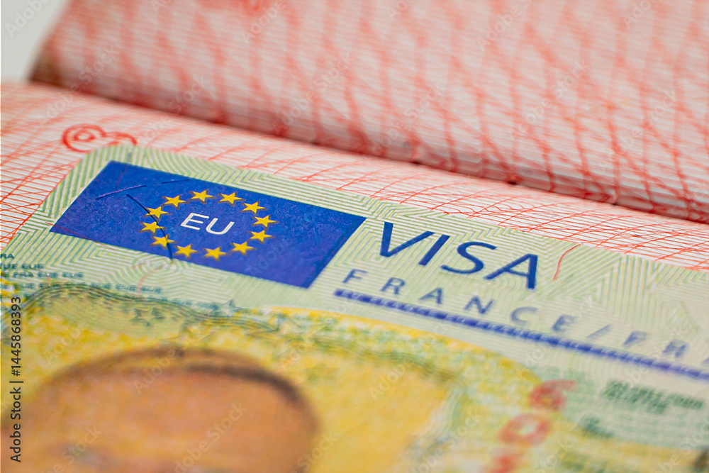 Fototapeta premium France Schengen visa in the passport, closeup. closed border of EC