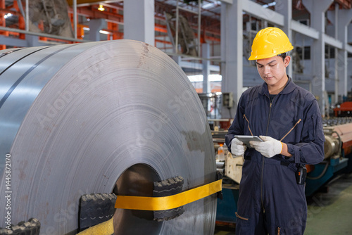 The factory engineer controls the machinery used to produce zinc sheets and uses radio for communication.