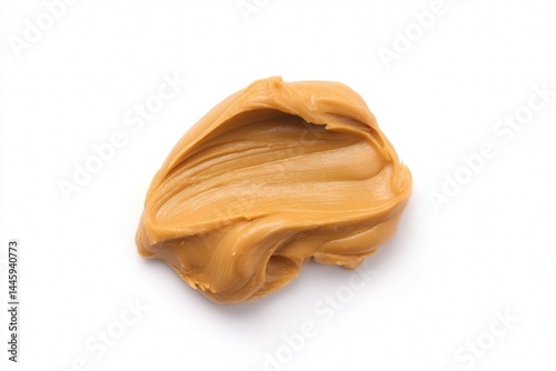 Spoonful of creamy peanut butter spread on white background
