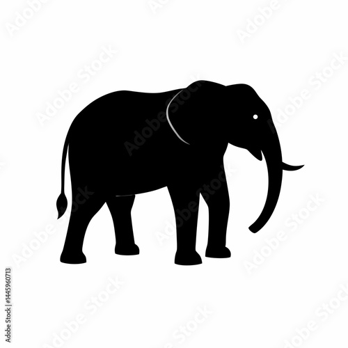 Silhouette of a black elephant with tusks and trunk raised