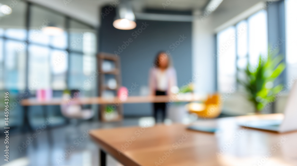 Fototapeta premium Office setting with a woman in the background engaged in a professional discussion