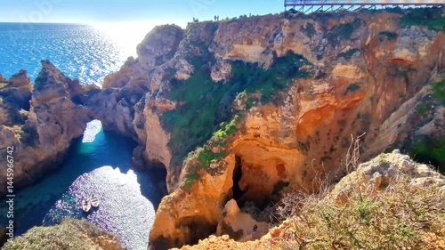 Amazing rocky scenic becahes of Algarve coast, Portugal. Breathtaking famous beach Praia da Marinha with yellow rocks with arc . 4k hd video
