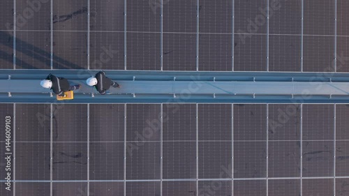 Engineers inspecting rooftop solar panels for maintenance