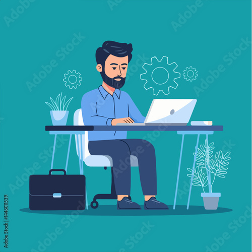 A man with a beard sits at a desk working on a laptop, wearing a blue shirt and dark pants. The desk has a plant in a pot, a briefcase, and a potted plant. 
