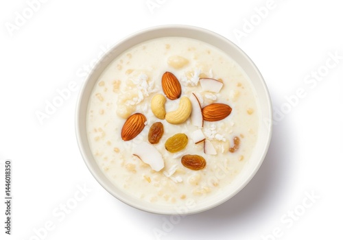 Bowl of indian sabudana kheer dessert with nuts and coconut flakes on white background photo