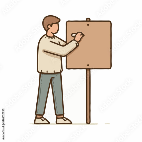 Man writing on blank protest sign 