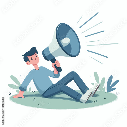 Man sitting with megaphone on grass