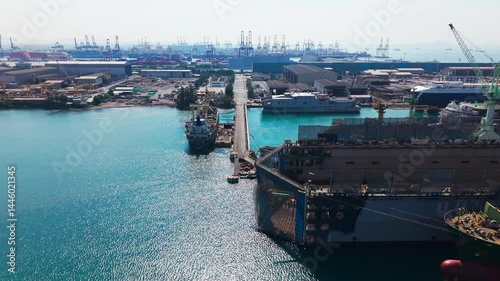 Large cargo ship transporting colorful containers across ocean
