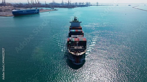 Large cargo ship transporting colorful containers across ocean