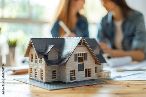 real estate agent expertly presents model homes to customers, providing them with one comprehensive understanding of mortgage contracts, loans, hire purchase contracts, and home sales, thereby introdu
