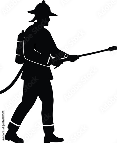 silhouette of a firefighter spraying water 
