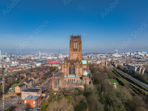 Obraz na płótnie Aerial view of Liverpool highlighting the Gothic Revival Liverpool Cathedral, tree lined streets, residential areas, and the distant waterfront. w salonie