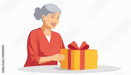 Senior woman happily opening a gift at home, joy and surprise