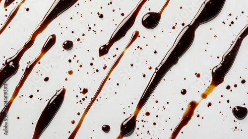 Brown sauce or balsamic glaze drizzled in a crosshatch pattern, isolated on a white background, top view