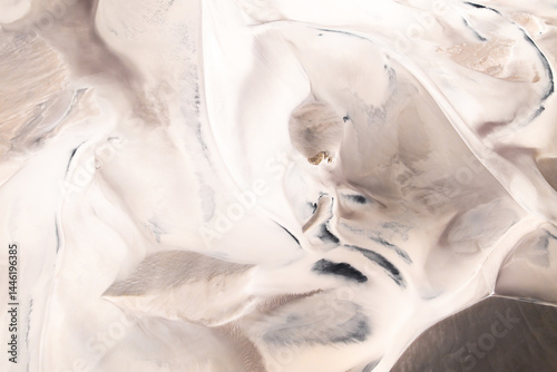 Aerial view of abstract desert patterns whit dunes in soft tones