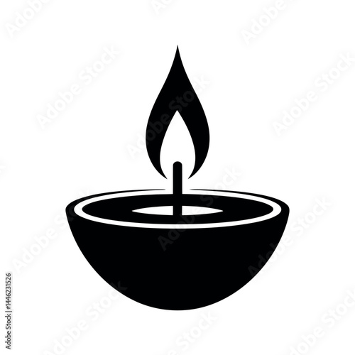 Silhouette of a decorative candle or oil lamp with a flame, simple black vector illustration of burning diya on white background