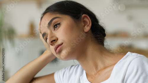 Arabian woman at home Indian female girl feeling headache pain anxiety bad mental health problem trouble depression fatigue chronic migraine tired lady in living room stress debt loan bankruptcy think