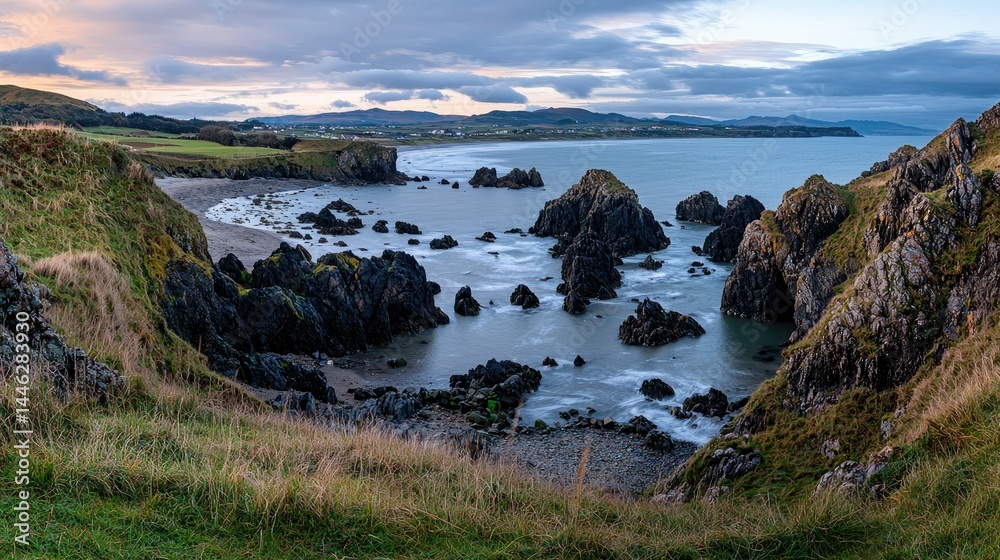 Dramatic coastal scene featuring rocky formations and the ocean waters