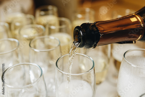Champagne Pouring into Glasses for Celebration