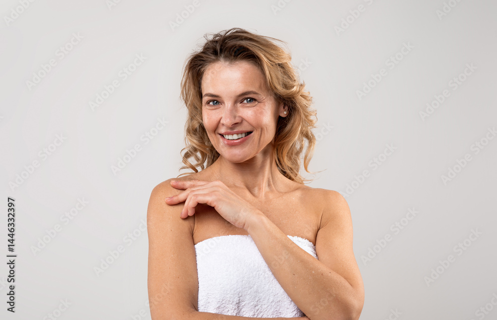 Portrait Of Pretty Middle Aged Female Wrapped In Bath Towel Posing Over Light Grey Background, Attractive Woman With Beautiful Skin Smiling At Camera, Enjoying Self-Care Treatments, Copy Space Portrait Of Pretty Middle Aged Female Wrapped In Bath Towel Posing Over Light Grey Background, Attractive Woman With Beautiful Skin Smiling At Camera, Enjoying Self-Care Treatments, Copy Space