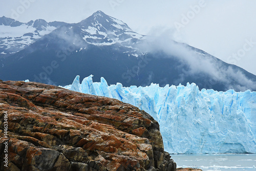 calving glacier in patagonia south america with mountains