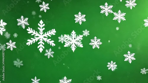 Snowflakes Falling on Green Background in Festive Winter Scene
