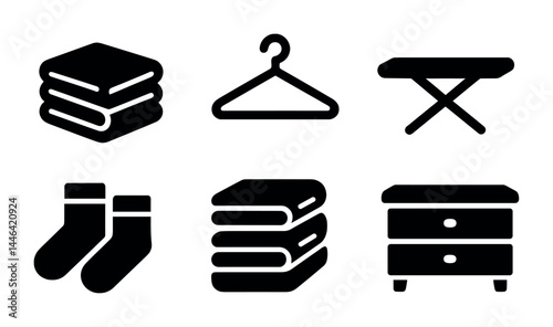 Home and laundry icon set – solid style household, cleaning, and organizing symbols for daily chores: towels, hanger, ironing board, socks, furniture, closet, drawer