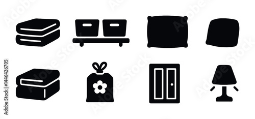 Home essentials solid icons set - filled style decor, interior, and comfort symbols for modern living: towels, storage boxes, cushions, pillow, blanket, wardrobe, lamp, shopping bag.