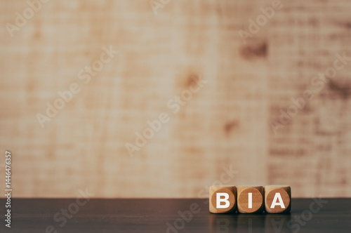 There is wood cube with the word BIA. It is an abbreviation for Business Impact Analysis as eye-catching image. photo
