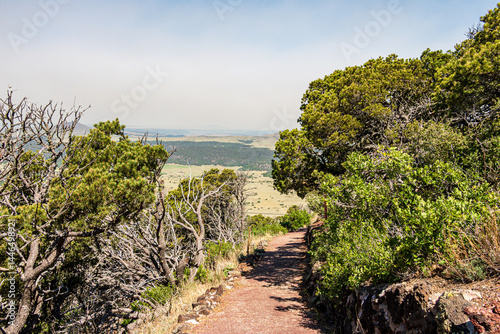 Serene landscape of the volcanic field seen from Crater Rim Trail at Capulin Volcano National Monument. Smoke in background is from wildfires at the time.