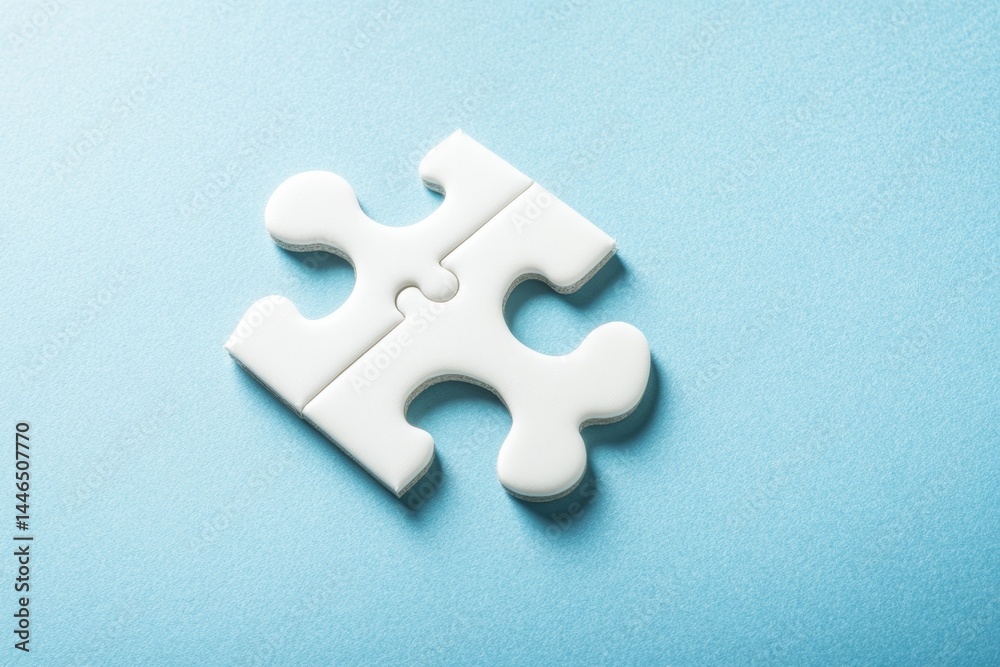 Obraz premium Two white puzzle pieces joined