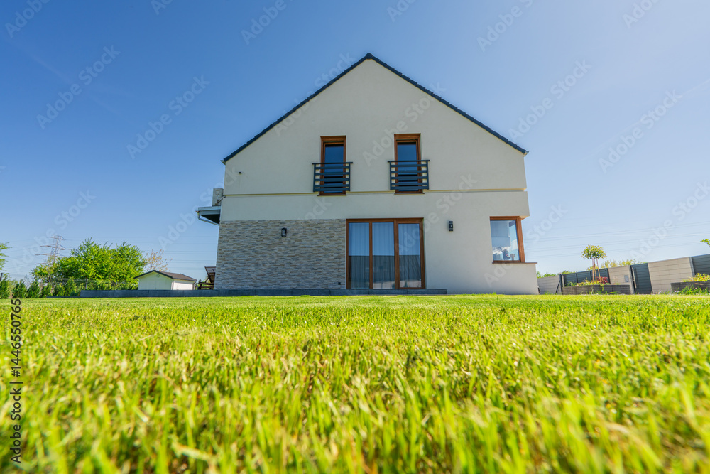 Side view of new build house with freshly cut grass