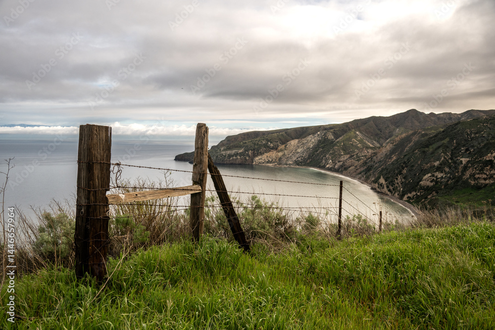 Old Wooden Fence Looks Out Over The Cliffs Above Chinese Harbor