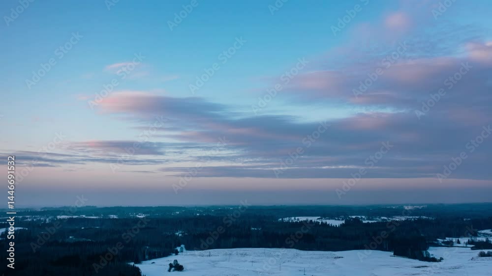 Aerial winter evening cloudscape hyperlapse. Magenta colors in the sky.