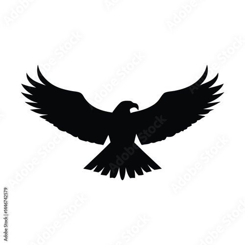 Silhouette of an eagle flying with spread wings on a white background
